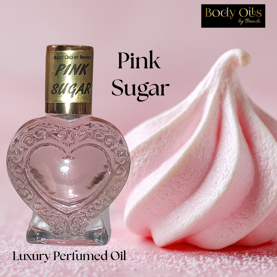 Heart-shaped bottle of 'Pink Sugar' perfumed oil with pink cream on a pink background, featuring 'Body Oils by Brenda'.